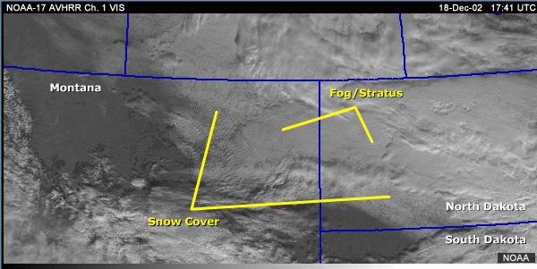Vis inage over the northcentral U.S. with annotations showing snow cover and fog/stratus