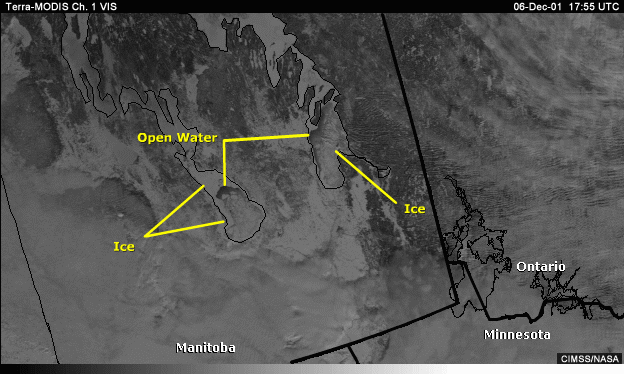 Vis image over Manitoba and the northern U.S. with annotations showing open water and ice covered lakes