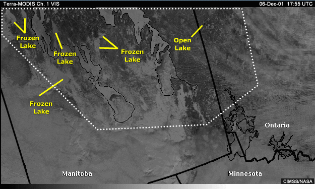 Vis image over Manitoba and the northern U.S. with annotations showing unmarked lakes